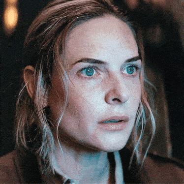 a woman with a serious look on her face