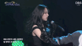 a group of people in animal costumes are dancing on a stage with a dbs logo in the background