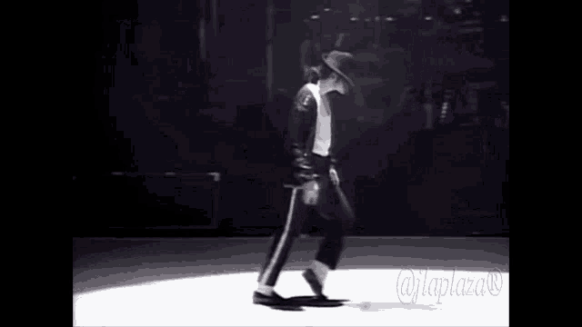 a man in a black hat is dancing on a stage with a caption that says @jplaza