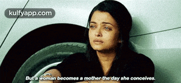 a woman is crying in front of a car with the words but a woman becomes a mother the day she conceives on the bottom