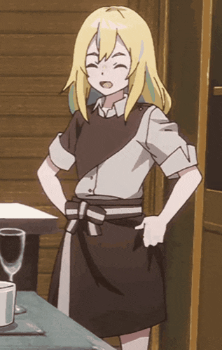 a girl with blonde hair is standing next to a table