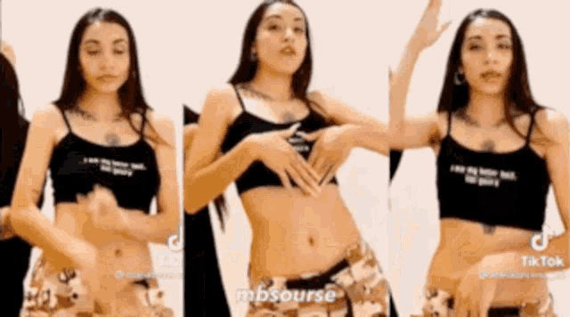 a woman in a crop top and camo pants shows off her stomach