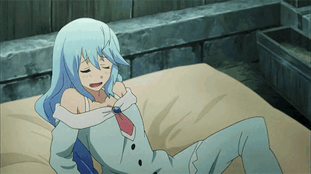 a woman with blue hair is laying on a bed with her eyes closed