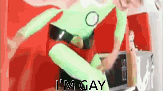 a person in a green superhero costume says i 'm gay .