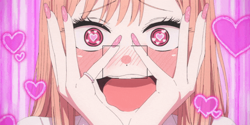 a girl with hearts in her eyes making a funny face