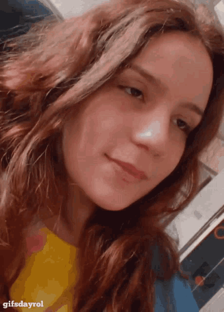 a close up of a woman 's face with the words gifsdayrol below