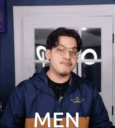 a man wearing glasses and a jacket with the word men on it .