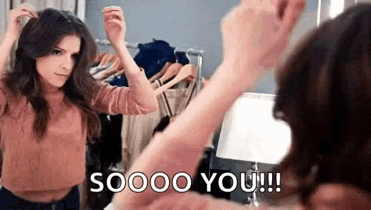 a woman is looking at herself in a mirror and saying `` soooo you !!! '' .
