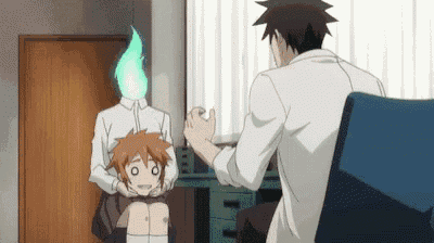 a man is sitting in a chair talking to a girl with a flame on her head .