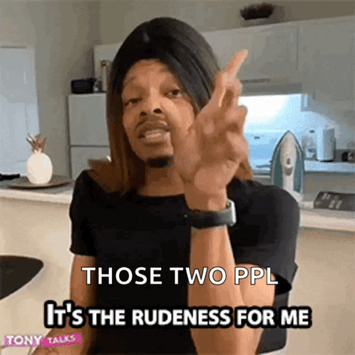 a man in a wig is giving the middle finger and says " those two ppl it 's the rudedness for me "