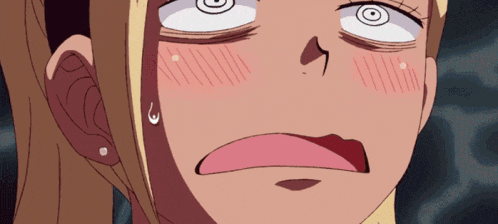 a close up of a girl 's face with a surprised expression
