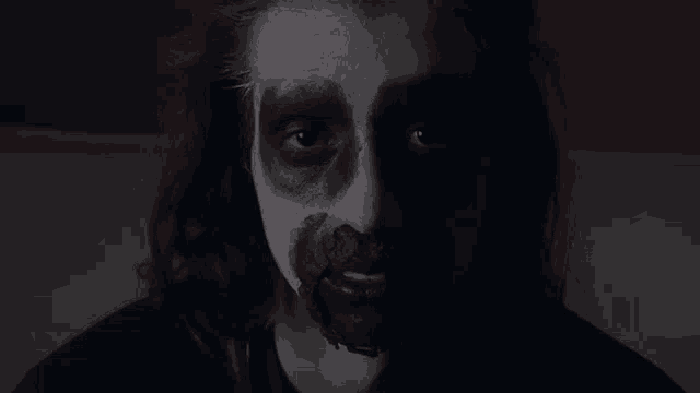 a close up of a person with blood on their face .