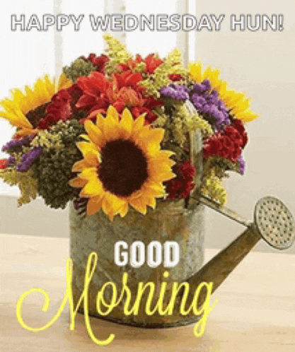 a bouquet of flowers in a watering can with the words good morning