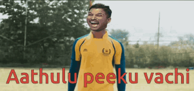 a man in a yellow jersey with the words aathulu peeku vachi on the bottom right