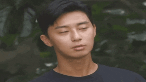 a close up of a man 's face with his eyes closed .