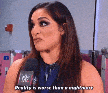 a woman is talking into a microphone and says reality is worse than a nightmare .