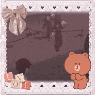 a picture frame with a brown teddy bear and the word love on it