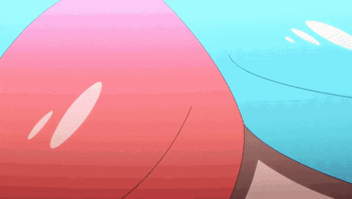 a close up of a pink and blue object with a white circle in the middle