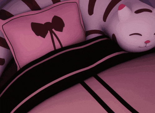 a pink pillow with a bow on it
