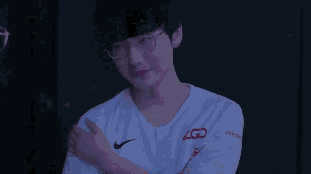a man wearing glasses and a shirt that says zgd on it