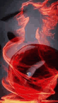 a close up of a red smoke coming out of a bottle on a table .
