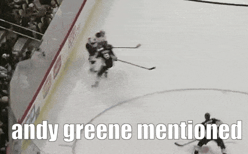 a hockey game with the words andy greene mentioned above it