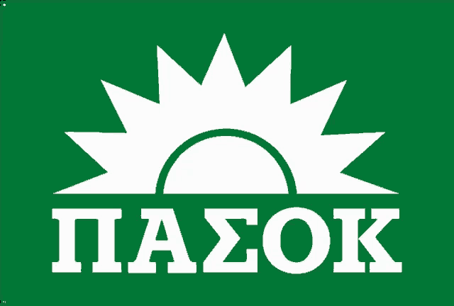 a green sign with a white sun and the word pasok below it