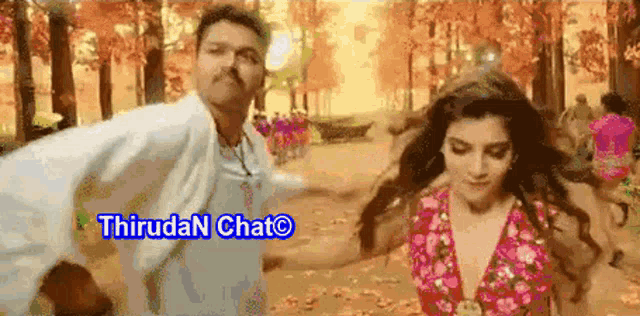 a man and a woman are dancing in a park with the words thirudan chat written in blue