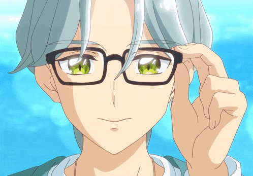 a close up of a person adjusting their glasses with a blue sky in the background