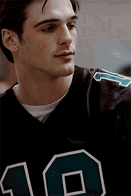 a close up of a man wearing a number 10 jersey