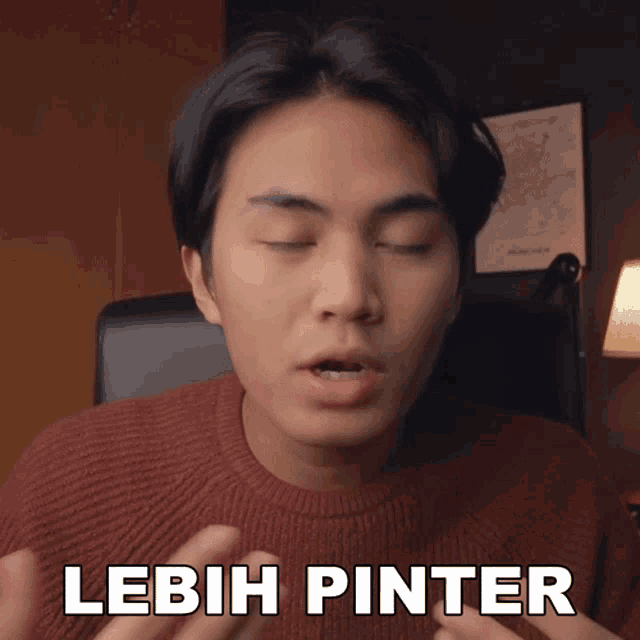 a man in a red sweater says " lebih pinter "