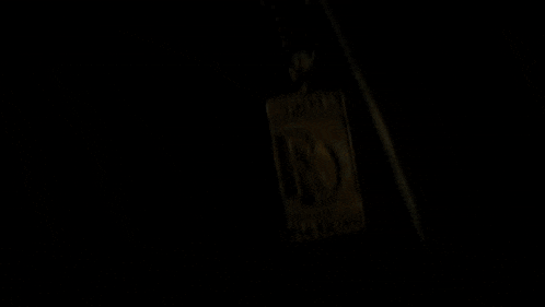 a gold pendant with a letter r on it