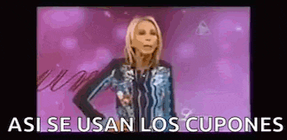 a woman in a blue jacket is standing in front of a pink background with the words `` asi se usan los cupones '' .