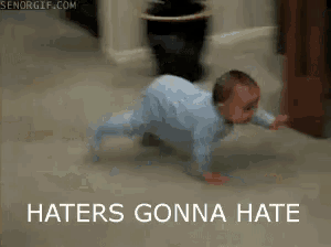 a baby is crawling on the floor with the words haters gonna hate below him