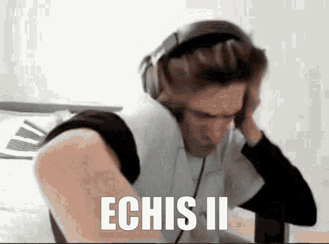 a man wearing headphones with the words echis ii written on it