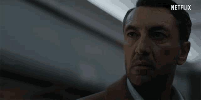 a close up of a man 's face with netflix written on the bottom