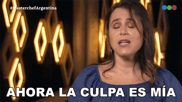 a woman with her eyes closed and the words ahora la culpa es mia below her
