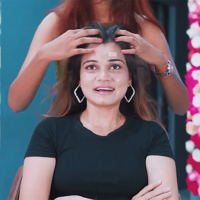 a woman has a bandage on her forehead