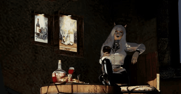 a woman sitting in front of a table with a bottle of wine on it