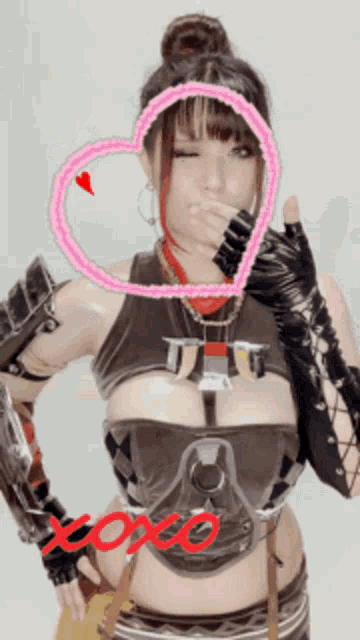 a woman in a costume with a heart and the word xoxo on it