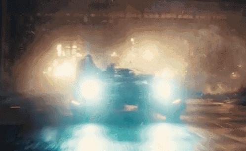 a car is driving through a tunnel with a lot of smoke coming out of it