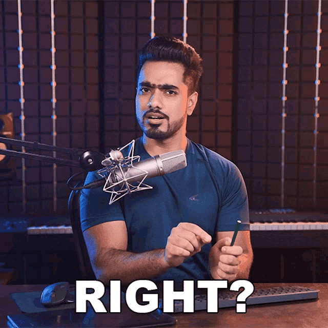 a man sitting in front of a microphone with the words right behind him