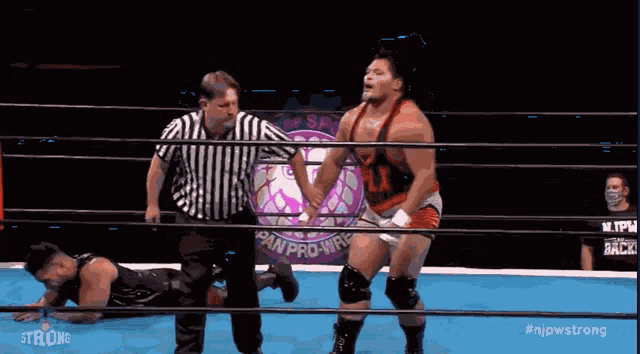 two men in a wrestling ring with the words strong on the bottom right