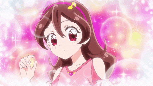 a girl in a pink dress with a pink headband with a note on it