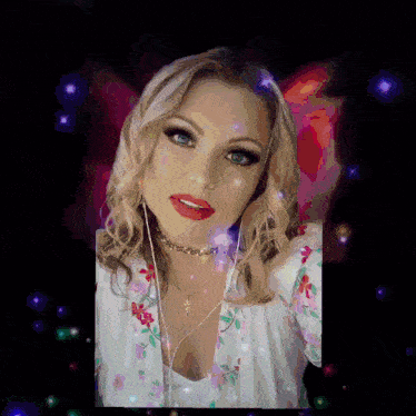 a woman wearing headphones and a choker looks at the camera .