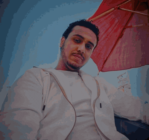 a man in a white jacket with a lightning bolt behind him