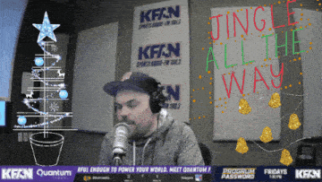 a man in front of a sign that says kfan
