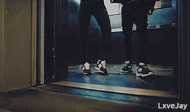 a man and a woman are walking down a hallway with the words lxve jay on the bottom