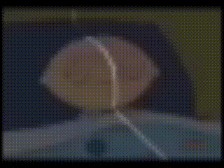 a blurry picture of a person 's face with a circle in the middle of it .