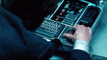 a person is typing on a keyboard with a red button that says ' esc ' on it